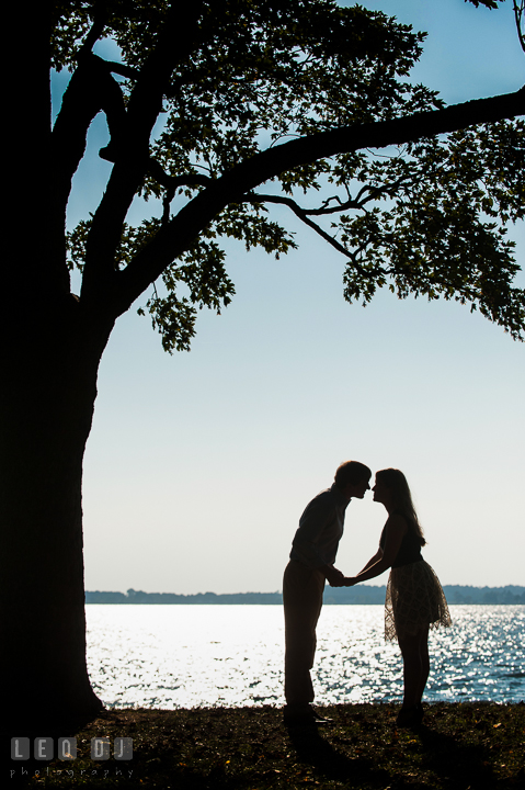 Silhoutte of engaged couple almost kissing. Oxford, Eastern Shore Maryland pre-wedding engagement photo session, by wedding photographers of Leo Dj Photography. http://leodjphoto.com