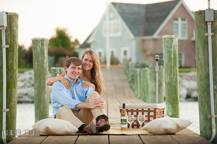 Engaged couple having a picnic on a boat dock. Oxford, Eastern Shore Maryland pre-wedding engagement photo session, by wedding photographers of Leo Dj Photography. http://leodjphoto.com