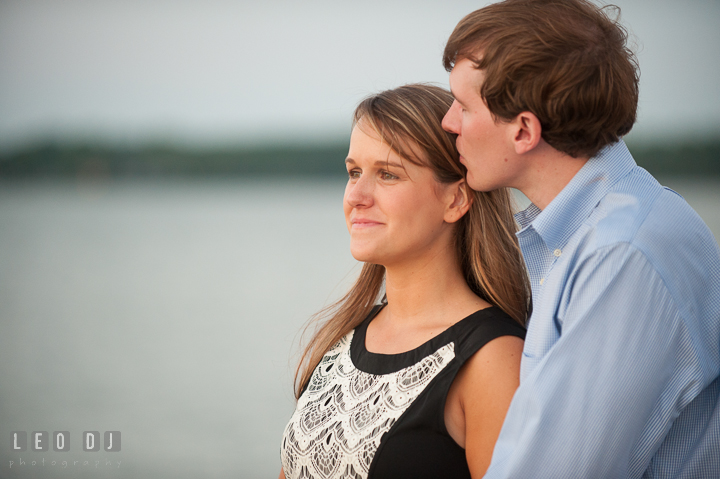 Engaged guy hugging and kissing his fiancée. Oxford, Eastern Shore Maryland pre-wedding engagement photo session, by wedding photographers of Leo Dj Photography. http://leodjphoto.com