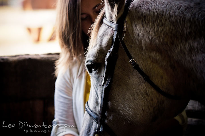 Horse and owner in a barn. Annapolis Kent Island Maryland High School Senior Portrait Photography with Horse Pet by photographer Leo Dj