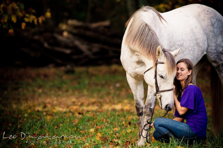Horse and owner showing their affection with each other. Annapolis Kent Island Maryland High School Senior Portrait Photography with Horse Pet by photographer Leo Dj