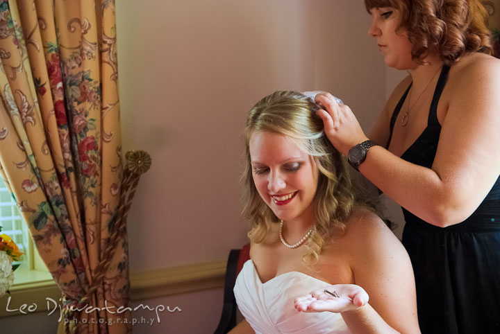 Best friend helping bride putting on veil. Mariott Aspen Wye River Conference Center Wedding photos at Queenstown Eastern Shore Maryland, by photographers of Leo Dj Photography.