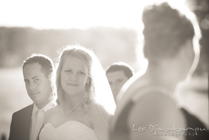 Bride, Groom, and Best Man looking at friend singing. Mariott Aspen Wye River Conference Center Wedding photos at Queenstown Eastern Shore Maryland, by photographers of Leo Dj Photography.