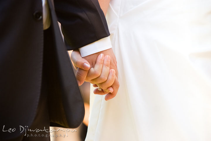 Close up of Bride and Groom holding hands during ceremony. Mariott Aspen Wye River Conference Center Wedding photos at Queenstown Eastern Shore Maryland, by photographers of Leo Dj Photography.