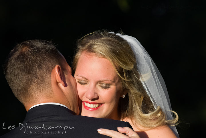 Bride and Groom hugging during the ceremony. Mariott Aspen Wye River Conference Center Wedding photos at Queenstown Eastern Shore Maryland, by photographers of Leo Dj Photography.