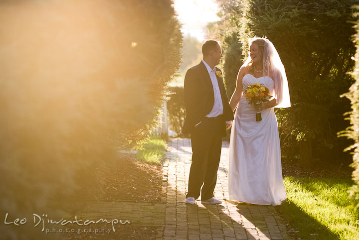 Bride and groom walking, holding hands. Mariott Aspen Wye River Conference Center Wedding photos at Queenstown Eastern Shore Maryland, by photographers of Leo Dj Photography.