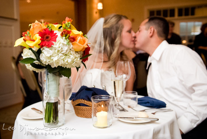 Bride and Groom kissing at the sweetheart table. Mariott Aspen Wye River Conference Center Wedding photos at Queenstown Eastern Shore Maryland, by photographers of Leo Dj Photography.