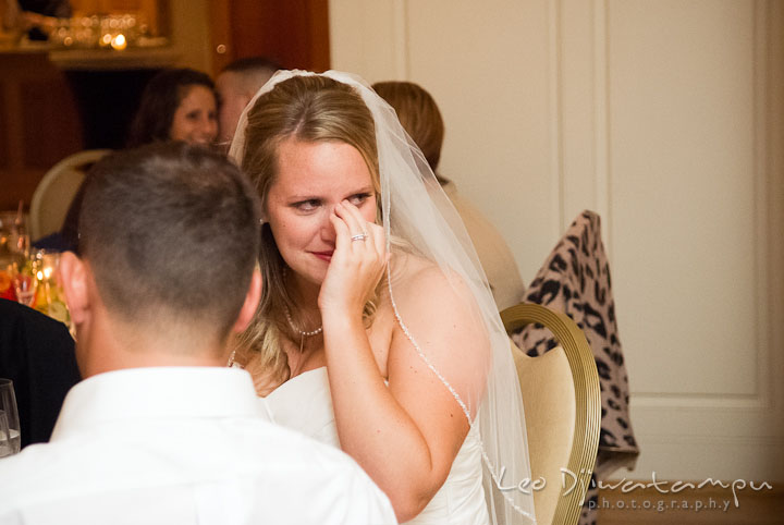 Bride wiping tears from eyes. Mariott Aspen Wye River Conference Center Wedding photos at Queenstown Eastern Shore Maryland, by photographers of Leo Dj Photography.