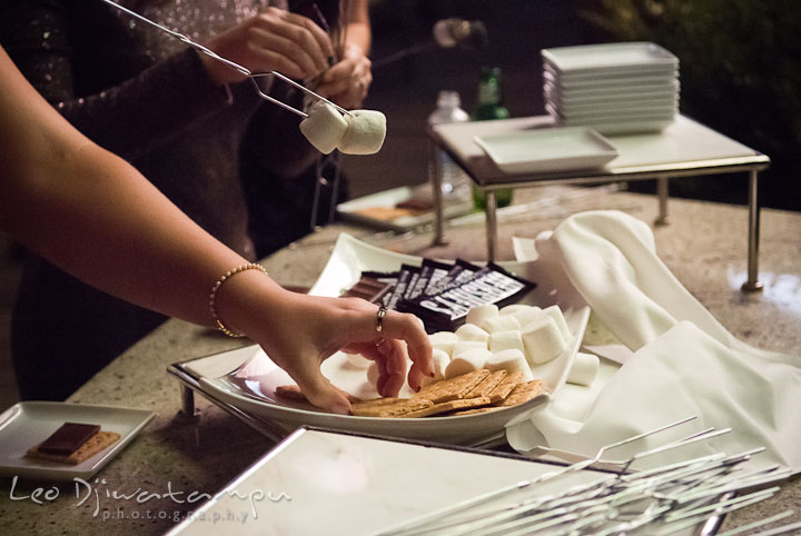 Guests making s'mores. Mariott Aspen Wye River Conference Center Wedding photos at Queenstown Eastern Shore Maryland, by photographers of Leo Dj Photography.