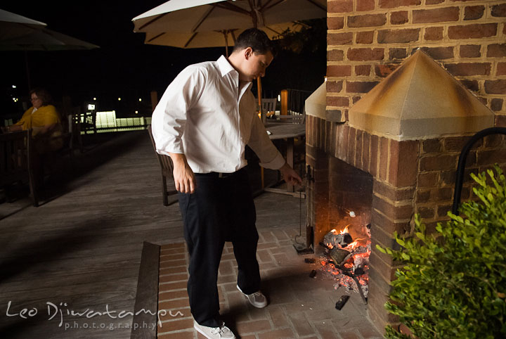 Best Man roasting the marshmallow. Mariott Aspen Wye River Conference Center Wedding photos at Queenstown Eastern Shore Maryland, by photographers of Leo Dj Photography.