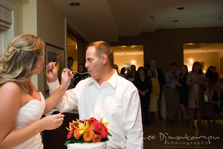 Bride and groom feeding cake to each other. Mariott Aspen Wye River Conference Center Wedding photos at Queenstown Eastern Shore Maryland, by photographers of Leo Dj Photography.