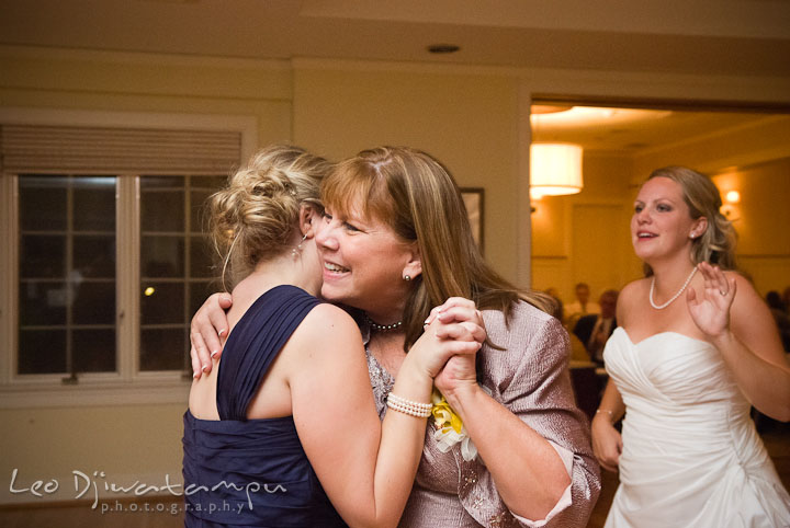 Mother of Bride and Bride's sister, Maid of Honor, hugging. Mariott Aspen Wye River Conference Center Wedding photos at Queenstown Eastern Shore Maryland, by photographers of Leo Dj Photography.