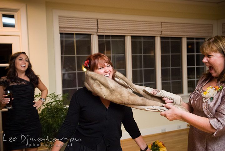 Mother of Bride being playful with guest. Mariott Aspen Wye River Conference Center Wedding photos at Queenstown Eastern Shore Maryland, by photographers of Leo Dj Photography.