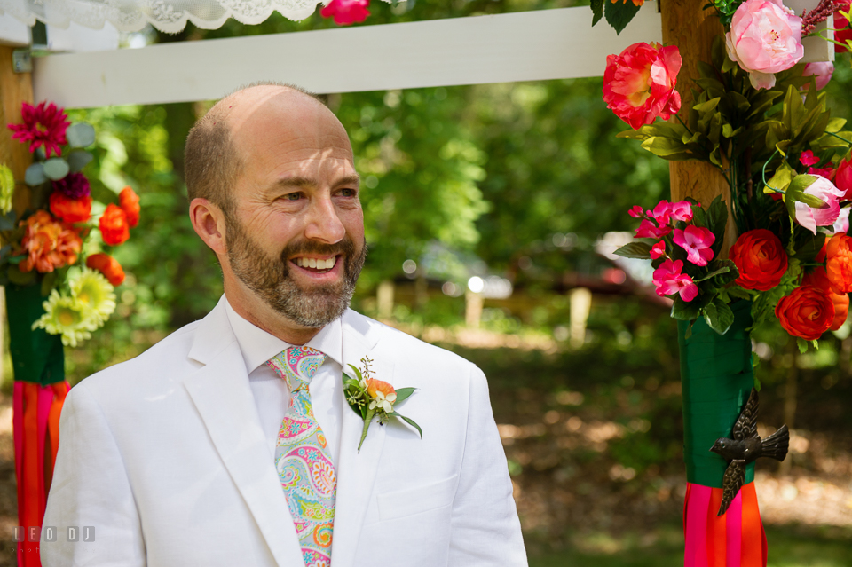At home backyard Groom seeing Bride for first time walking down the aisle during ceremony photo by Leo Dj Photography