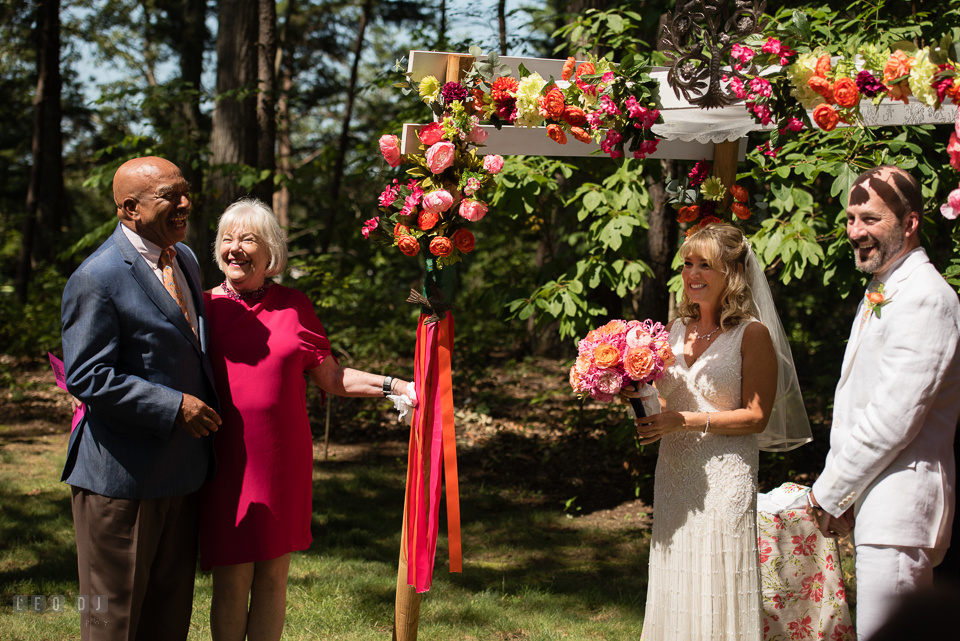 At home backyard wedding Father and Mother of Bride giving speech at ceremony photo by Leo Dj Photography