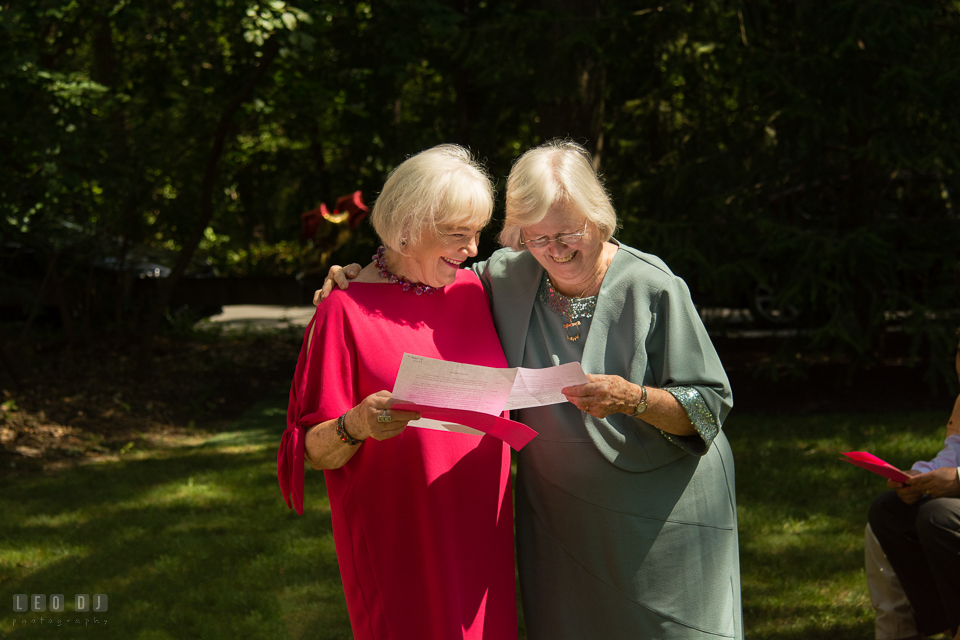 At home backyard wedding Mothers of Bride and Groom reading prayer at ceremony photo by Leo Dj Photography