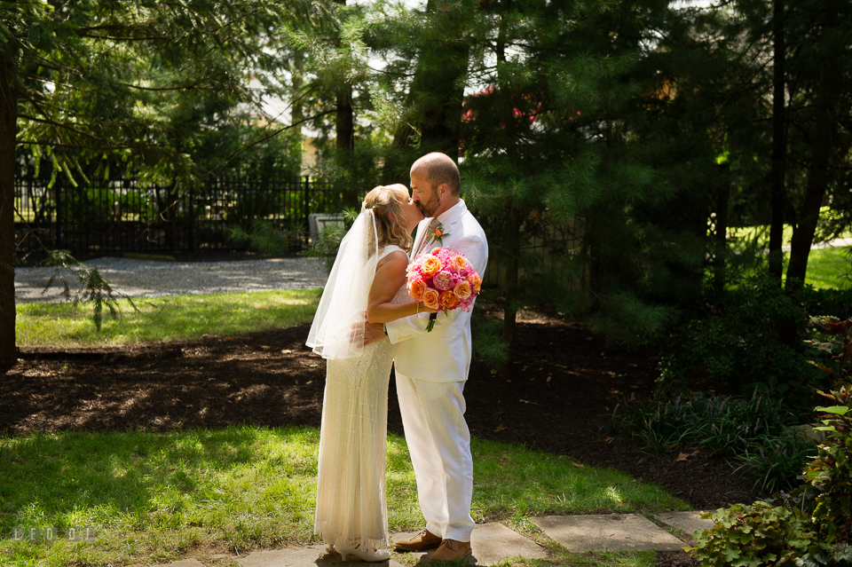 At home backyard wedding Bride and Groom kiss after ceremony photo by Leo Dj Photography