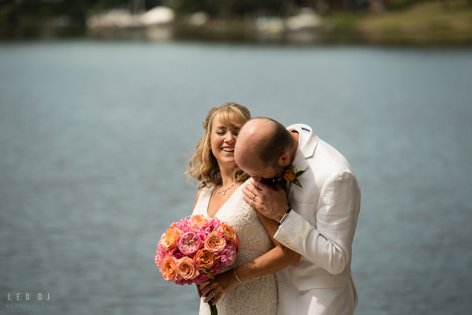 At home backyard wedding Groom kiss Bride on shoulder photo by Leo Dj Photography