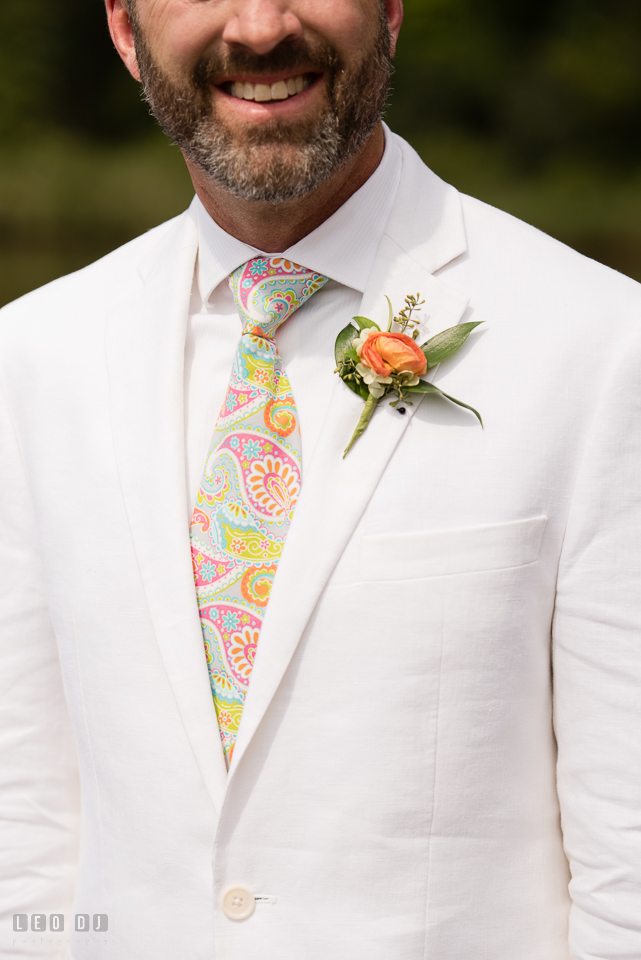 At home backyard wedding close up of Groom's tie and boutonniere photo by Leo Dj Photography