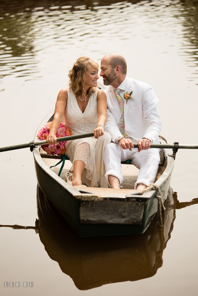 At home backyard wedding Bride and Groom cuddling on boat photo by Leo Dj Photography