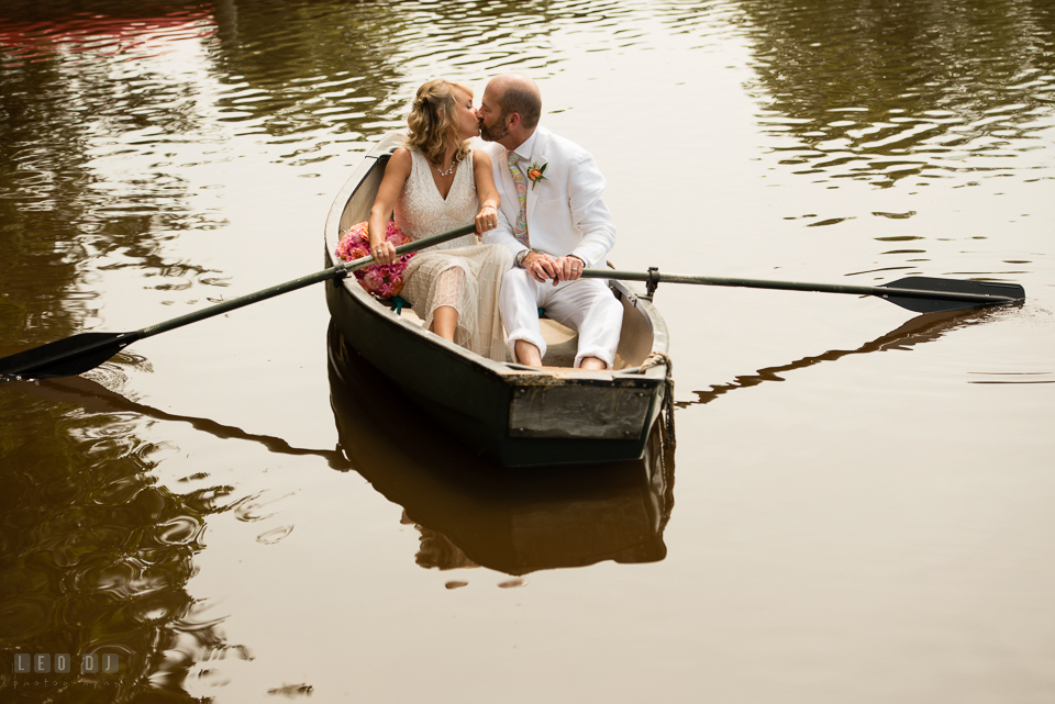 At home backyard wedding Bride and Groom kissing on boat photo by Leo Dj Photography