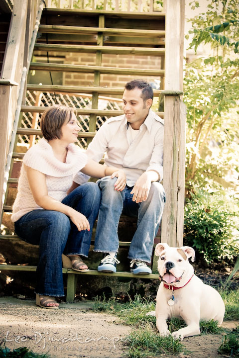 Engaged couple with their boxer dog. Candid Old Town Alexandria Virginia Engagement Photography Session by Wedding Photographer Leo Dj