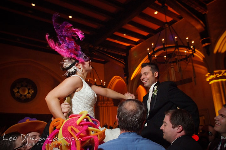 Bride and groom lifted up on chairs by guests during Carnaval Carioca. Tremont Grand Historic Venue Baltimore Wedding photos by photographers of Leo Dj Photography