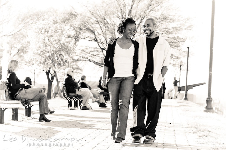 engaged couple walking together, laughing. Federal Hill Park Baltimore pre-wedding engagement portrait