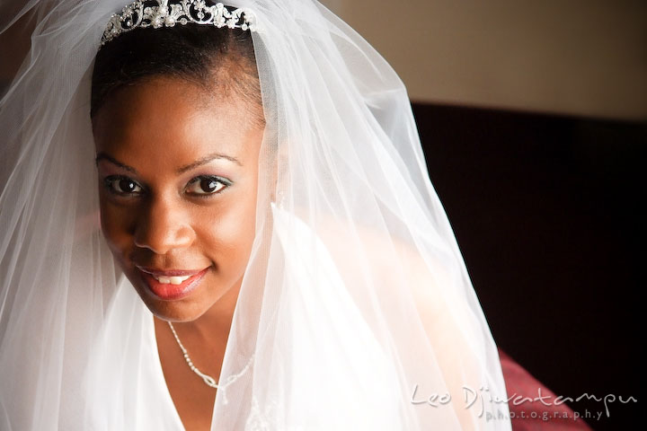 Beautiful African American bride looking up smiling. Wedding photography at Padonia Park Club at Towson, Timonium-Cockeysville area, North of Baltimore