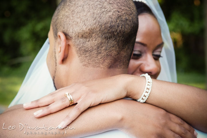 Bride and groom hugging, showing engagement and wedding rings, and the bracelet. Wedding photography at Padonia Park Club at Towson, Timonium-Cockeysville area, North of Baltimore