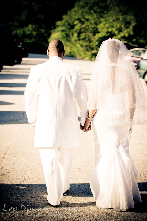 Bride and groom holding hands, walking together. Wedding photography at Padonia Park Club at Towson, Timonium-Cockeysville area, North of Baltimore