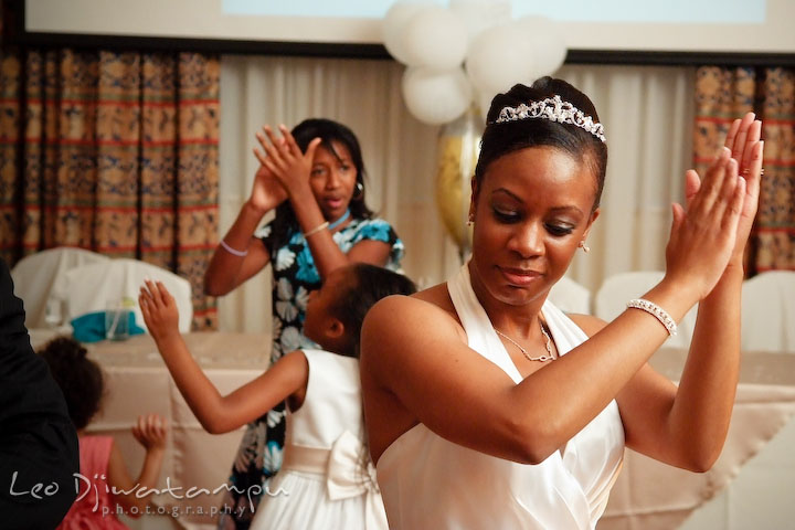 Bride and other guest clapping their hands, dancing to the music of DJ Casper, Cha Cha Slide. Wedding photography at Padonia Park Club at Towson, Timonium-Cockeysville area, North of Baltimore