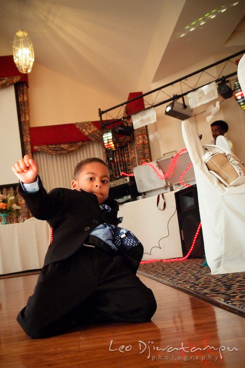 Boy sliding on the dance floor. Wedding photography at Padonia Park Club at Towson, Timonium-Cockeysville area, North of Baltimore