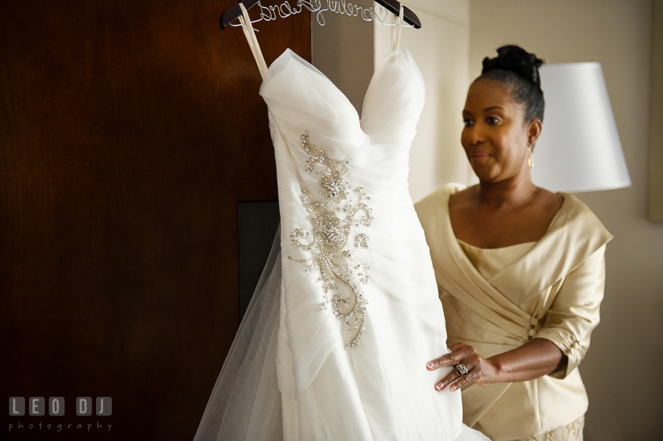 Mother of the Bride looking at the wedding dress by Simone Carvalli from Jeanette's Bridal. Falls Church Virginia 2941 Restaurant wedding ceremony and reception photo, by wedding photographers of Leo Dj Photography. http://leodjphoto.com