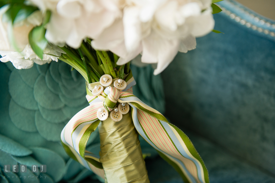 Something old, buttons from Bride's late father, incorporated on the floral bouquet from florist Highway to Hill. Falls Church Virginia 2941 Restaurant wedding ceremony and reception photo, by wedding photographers of Leo Dj Photography. http://leodjphoto.com