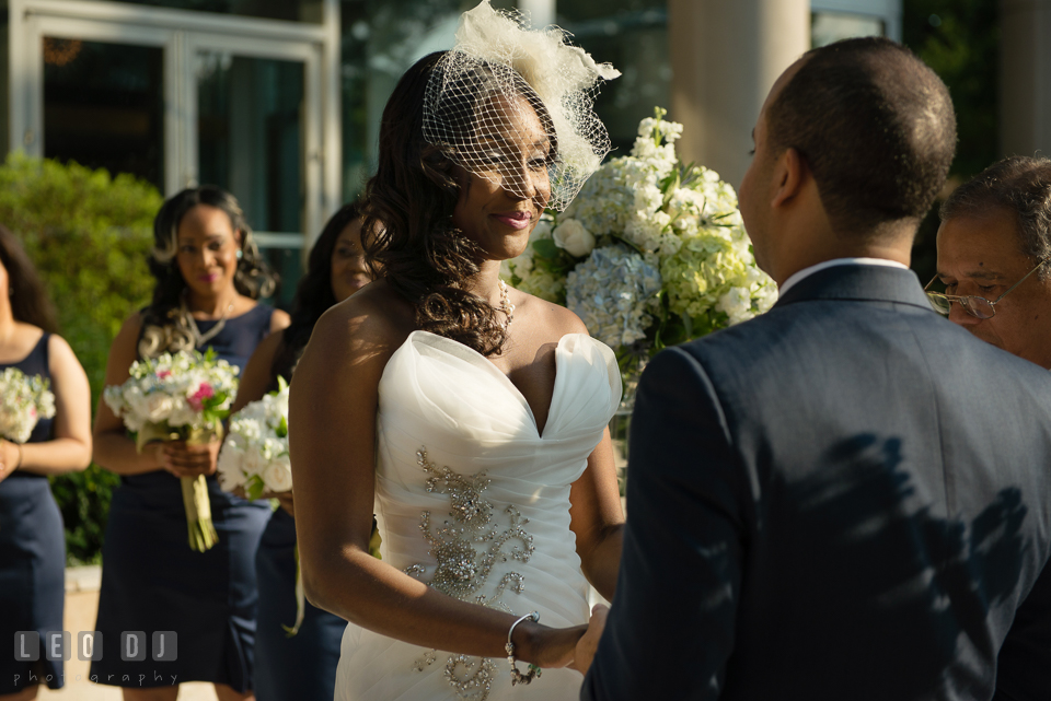 Happy smile from the beautiful Bride during the wedding ceremony. Falls Church Virginia 2941 Restaurant wedding ceremony and reception photo, by wedding photographers of Leo Dj Photography. http://leodjphoto.com