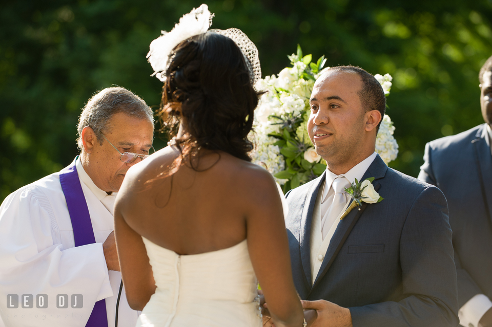 Happy smile from the Groom during his vow to his Bride. Falls Church Virginia 2941 Restaurant wedding ceremony and reception photo, by wedding photographers of Leo Dj Photography. http://leodjphoto.com