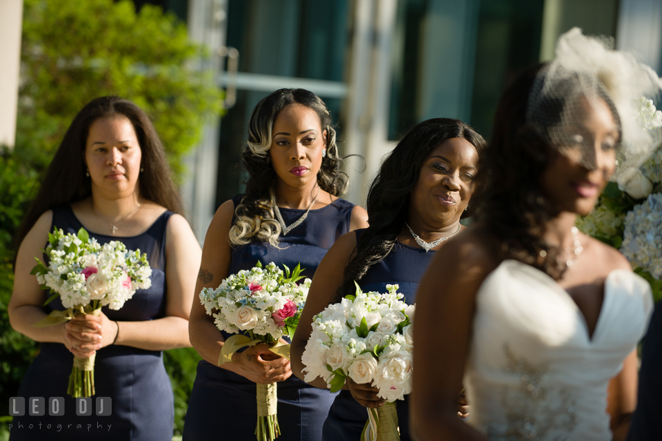 The Maid of Honor and Bridesmaids smiled during the wedding ceremony. Falls Church Virginia 2941 Restaurant wedding ceremony and reception photo, by wedding photographers of Leo Dj Photography. http://leodjphoto.com