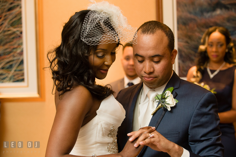 Bride and Groom looking at each other's ring during the first dance. Falls Church Virginia 2941 Restaurant wedding ceremony and reception photo, by wedding photographers of Leo Dj Photography. http://leodjphoto.com