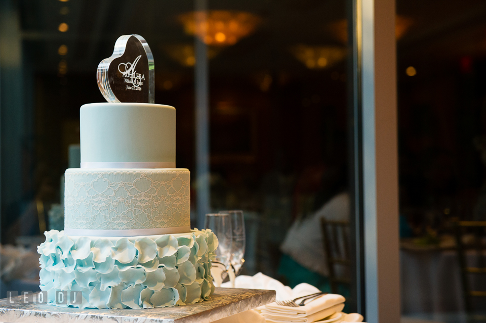 A touch of blue on the wedding cake by Layered Cake Patisserie. Falls Church Virginia 2941 Restaurant wedding ceremony and reception photo, by wedding photographers of Leo Dj Photography. http://leodjphoto.com