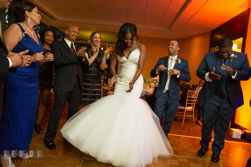 The Bride, Groom, and guests dancing to music from DJ Michael Cruz from Bialek's Music. Falls Church Virginia 2941 Restaurant wedding ceremony and reception photo, by wedding photographers of Leo Dj Photography. http://leodjphoto.com