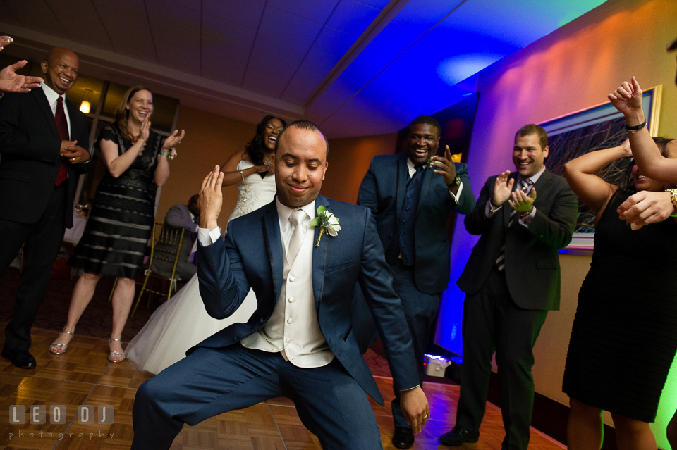 The Groom strike a pose dancing during the open dance floor at the reception. Falls Church Virginia 2941 Restaurant wedding ceremony and reception photo, by wedding photographers of Leo Dj Photography. http://leodjphoto.com