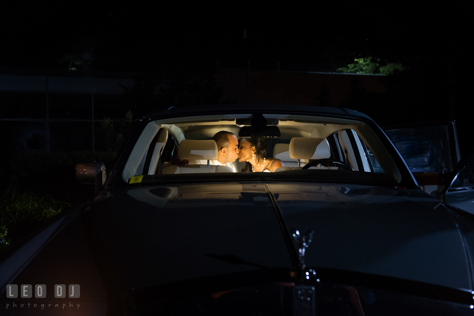 Bride and Groom kissing inside a Rolls Royce limo from Vintage Limos. Falls Church Virginia 2941 Restaurant wedding ceremony and reception photo, by wedding photographers of Leo Dj Photography. http://leodjphoto.com