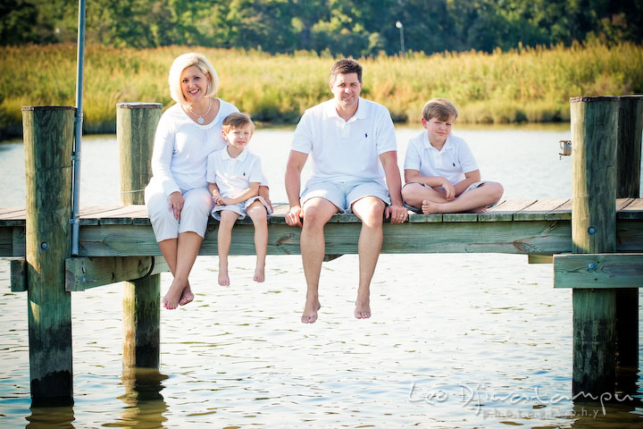 Family sitting and posing on a pier. Kent Island, Annapolis, MD Fun Candid Family Lifestyle Photographer, Leo Dj Photography