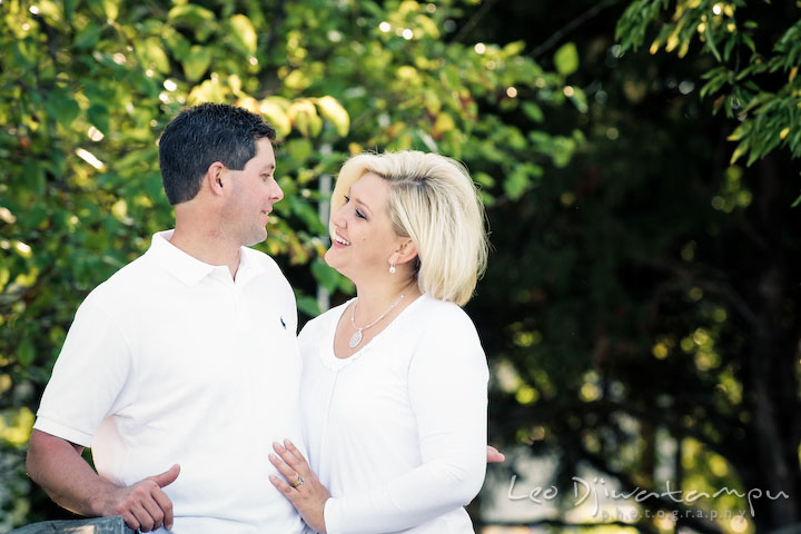 Mother and father talking to each other and smiling. Kent Island, Annapolis, MD Fun Candid Family Lifestyle Photographer, Leo Dj Photography