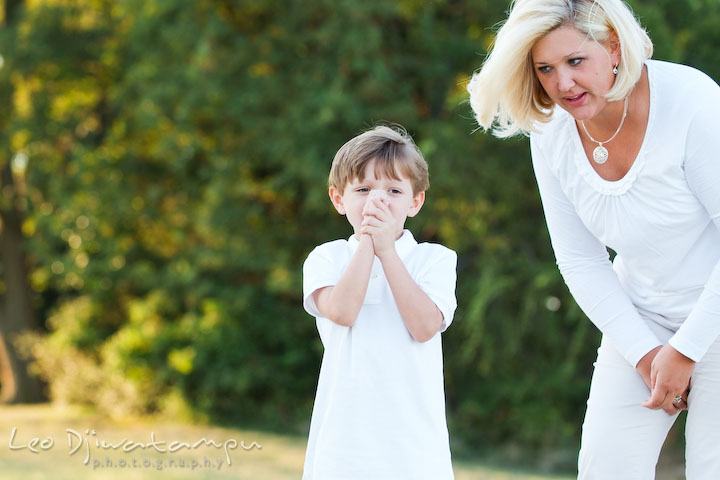 Mom showing his son how to do stone skipping. Kent Island, Annapolis, MD Fun Candid Family Lifestyle Photographer, Leo Dj Photography