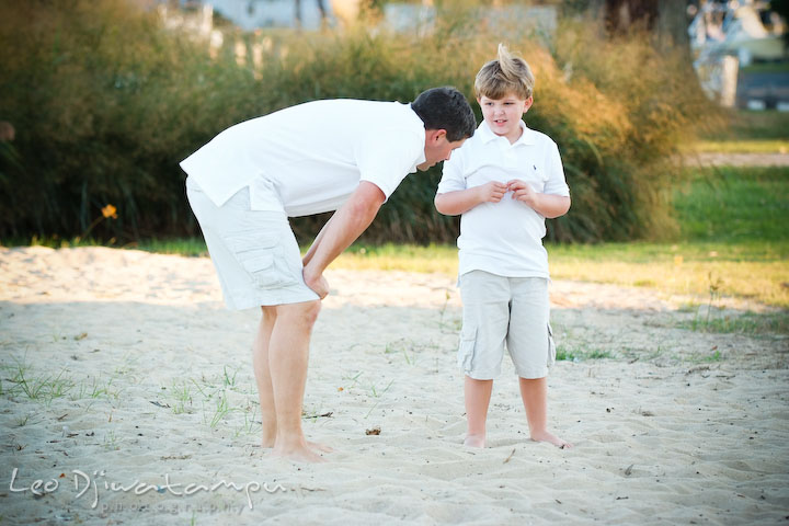Dad listening carefully to his son talking. Kent Island, Annapolis, MD Fun Candid Family Lifestyle Photographer, Leo Dj Photography