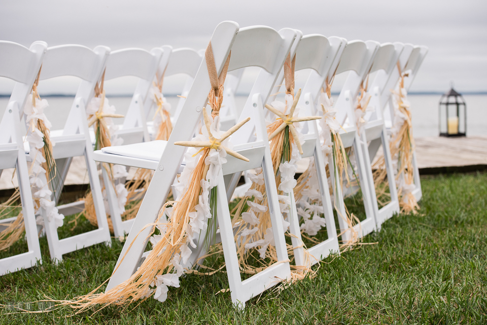 Silver Swan Bayside grass skirt tassels and starfish chair decor photo by Leo Dj Photography