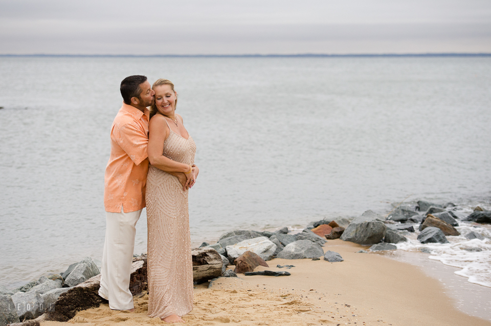 Silver Swan Bayside wedding Groom hug Bride on the beach photo by Leo Dj Photography