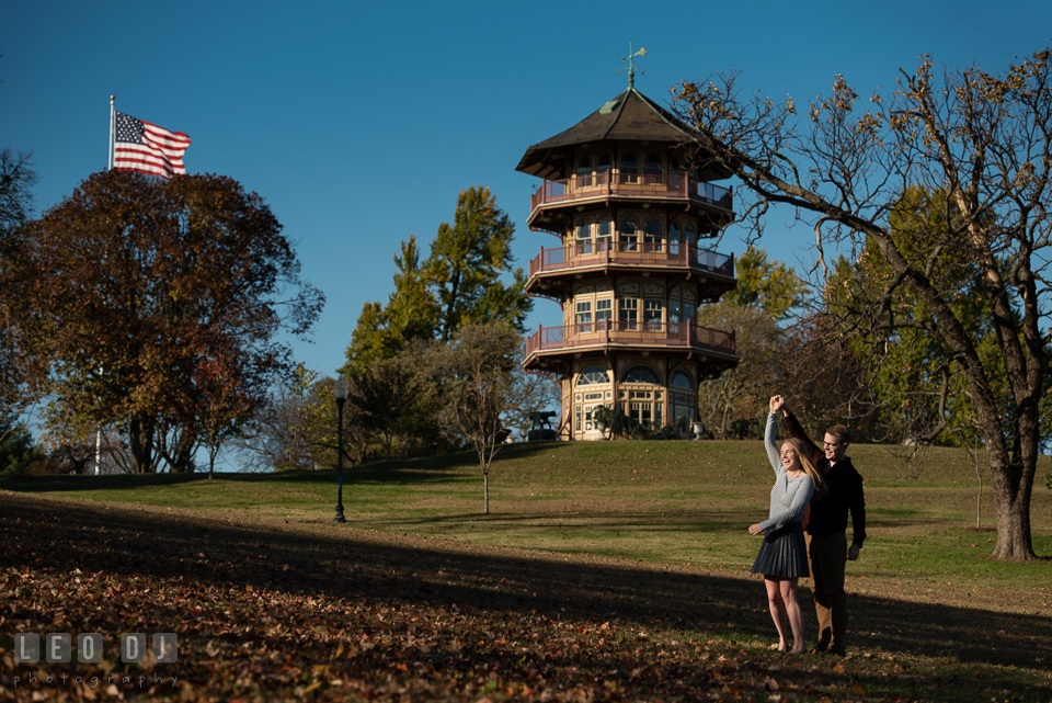 Patterson Park Baltimore Maryland engaged couple dancing by pagoda photo by Leo Dj Photography.